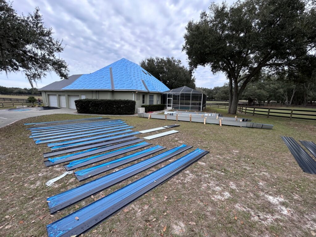 Metal roofing panels staged on-site before installation by Southern Pro Roofing in Central Florida